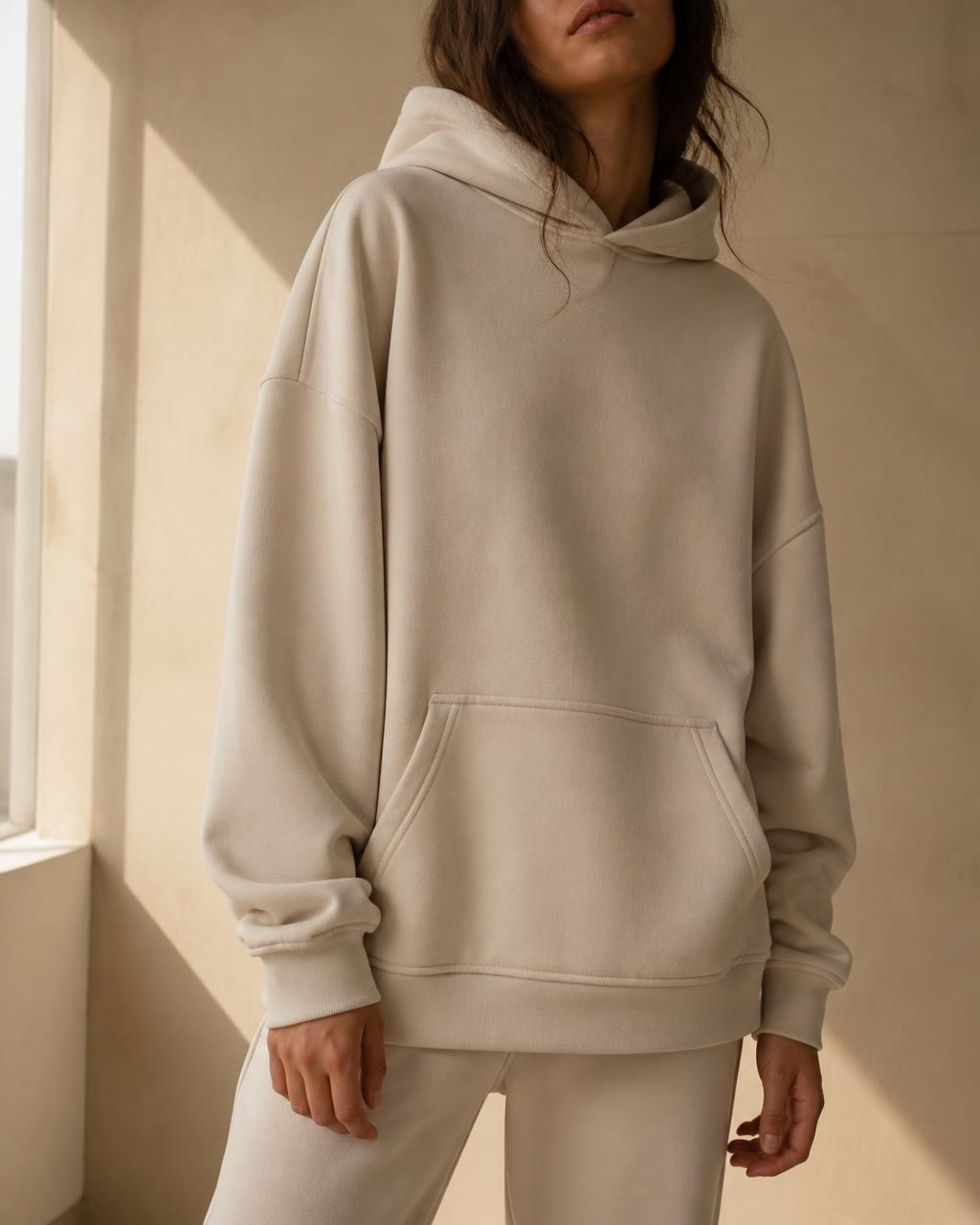 Model wearing a bone heavy hoodie — “you are allowed to rest”