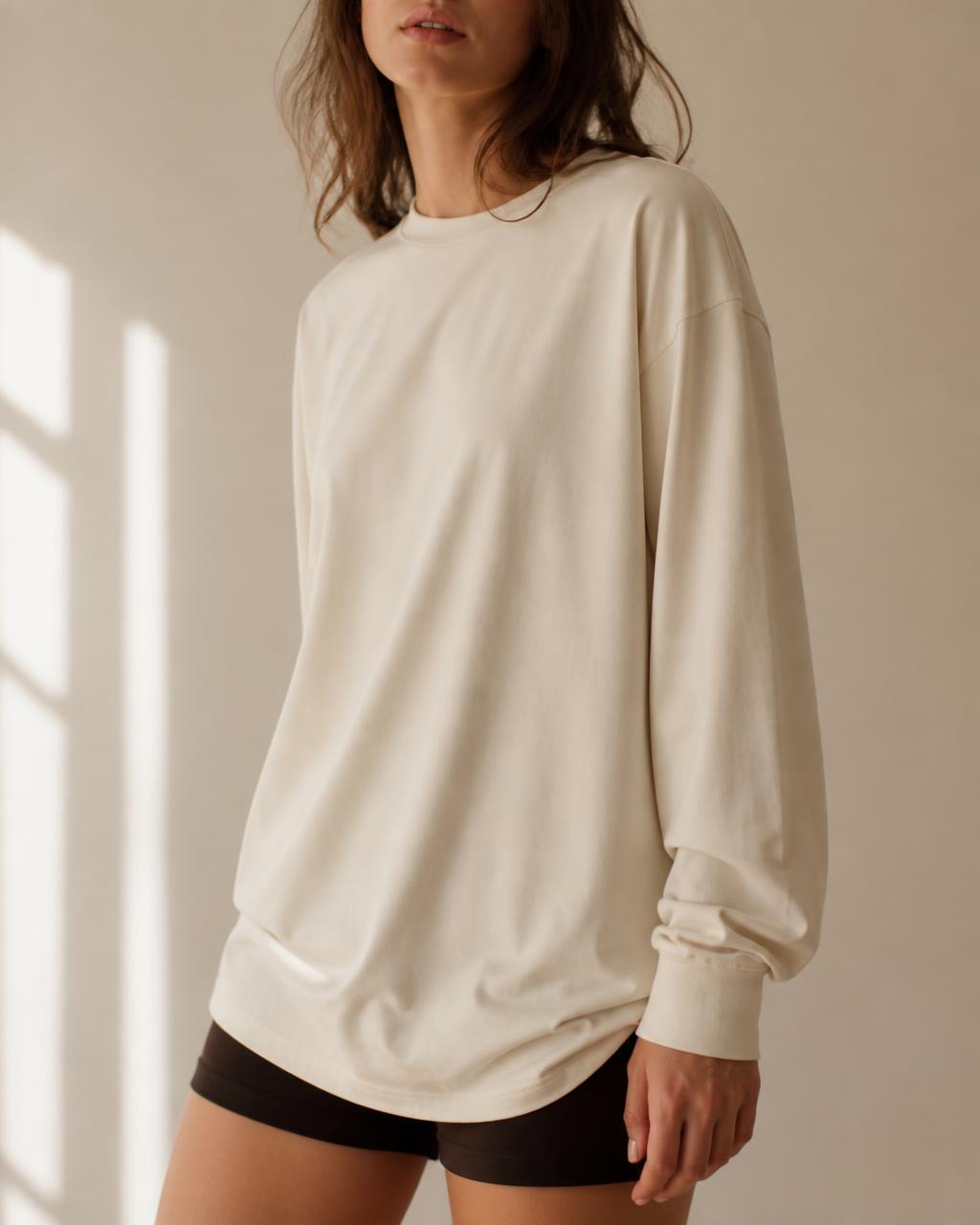 Model wearing a bone long sleeve tee — “be brave”