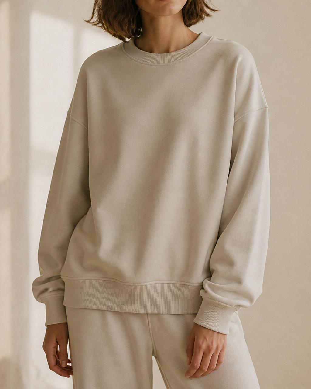 Model wearing a sand crew sweatshirt — “keep going, quietly”