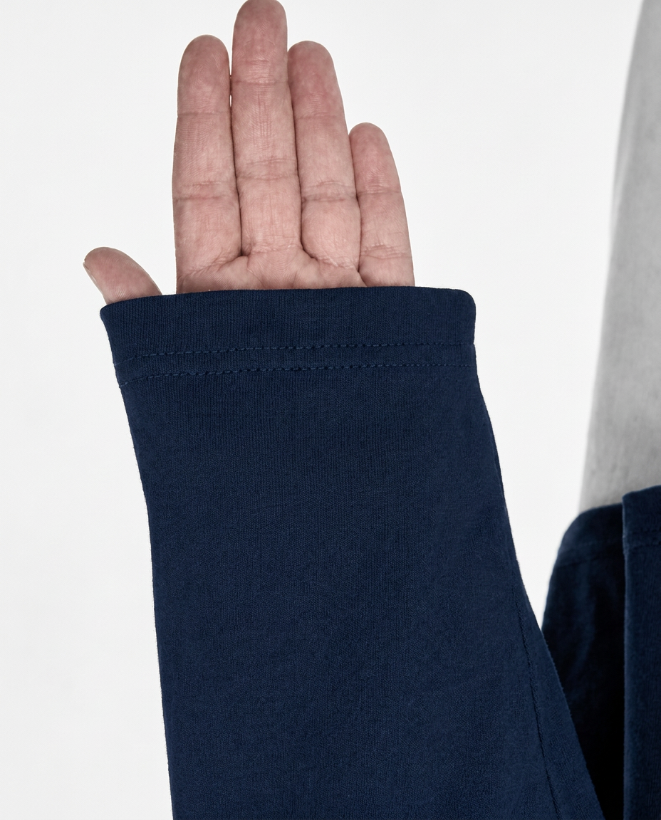 Navy long sleeve with “God's in control” printed above the left cuff
